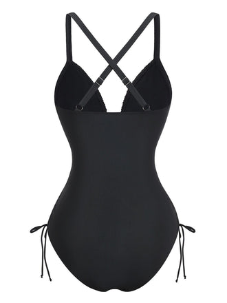 Rear view of the black one-piece swimsuit highlighting the elegant cross-back strap design and full coverage bottom.