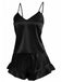 The two-piece silky satin cami and shorts set shown in classic black with feminine ruffle details.