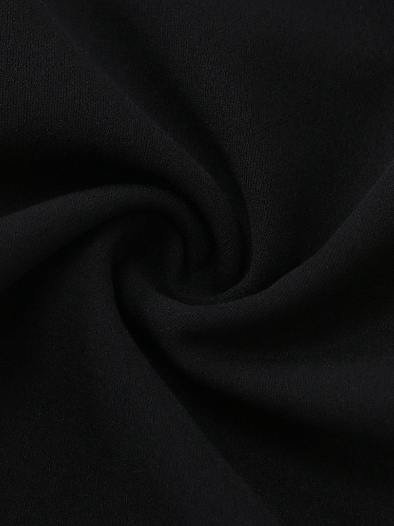 Close-up of black fabric with a swirling pattern