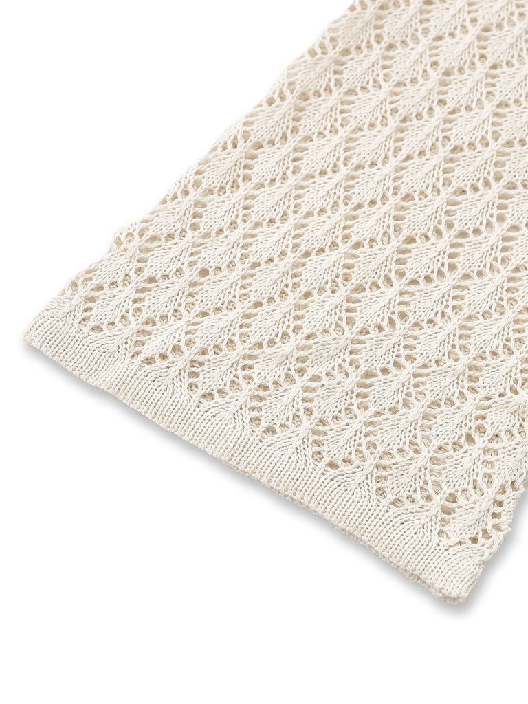 Detailed view of the flared bell sleeve on a cream boho-style crochet cover-up.