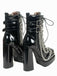 Bottes gothiques talons hauts vernis noir et ornées de chaînes