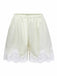 Studio front view of the cream-colored satin pajama shorts featuring an elastic waistband and wide lace-trimmed legs.