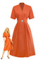 Robe unie orange à col en V et boutons et broche années 1940