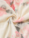 A swirled close-up of the cream fabric highlighting the soft texture and detailed rose print.