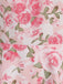 Close-up of the waistline seam illustrating the seamless transition of the rose pattern between the bodice and skirt.