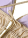 Close-up of gold Swimsuit with a white background