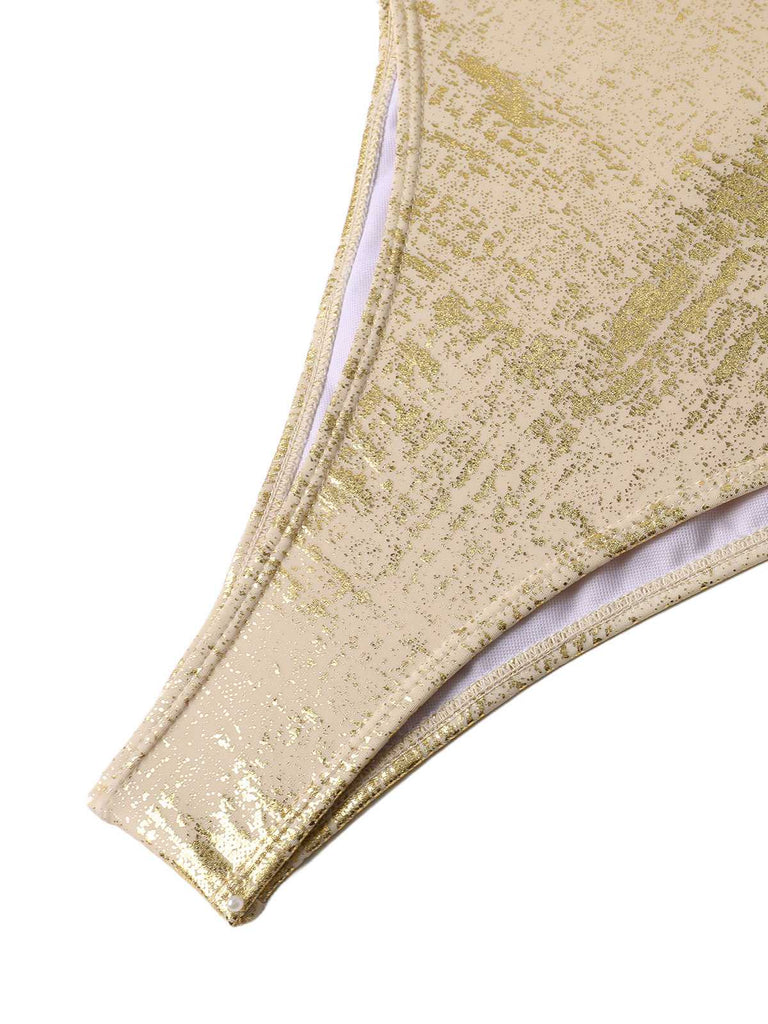 Gold glittery fabric on a white background