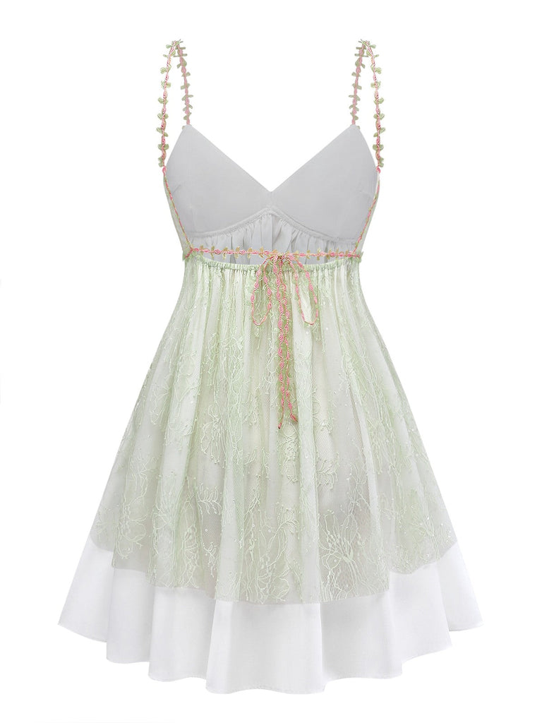 Light green nightdress with white lace trim on a white background