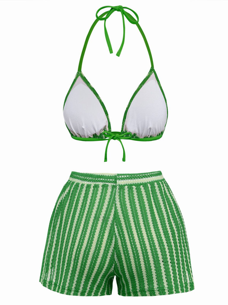 Green and white bikini set on a white background
