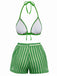 Green and white bikini set on a white background