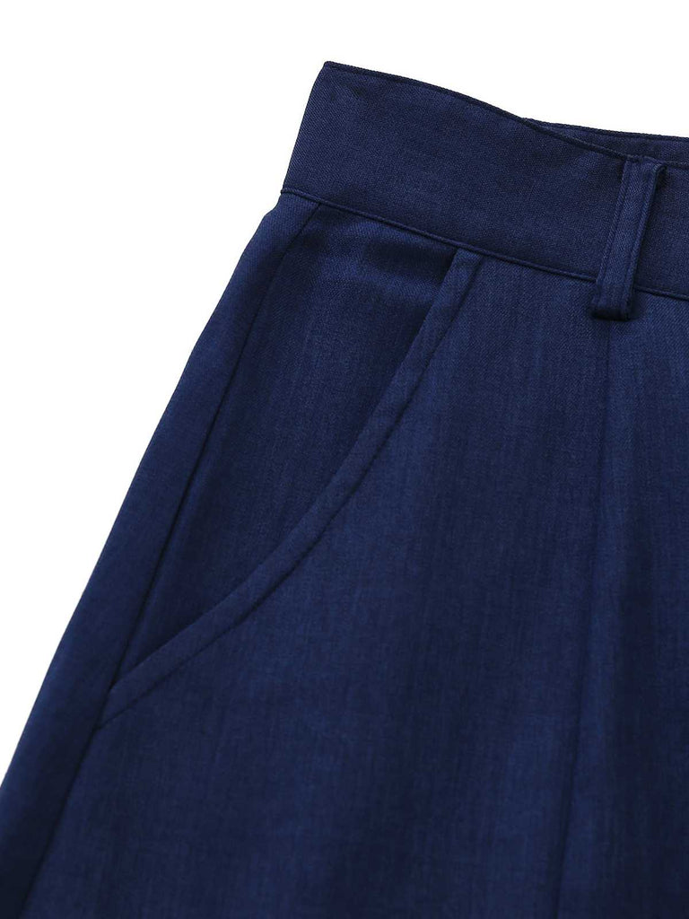 Detailed view of the integrated side seam pocket on the navy blue skirt.