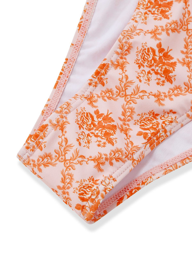 Orange floral patterned fabric on a white background