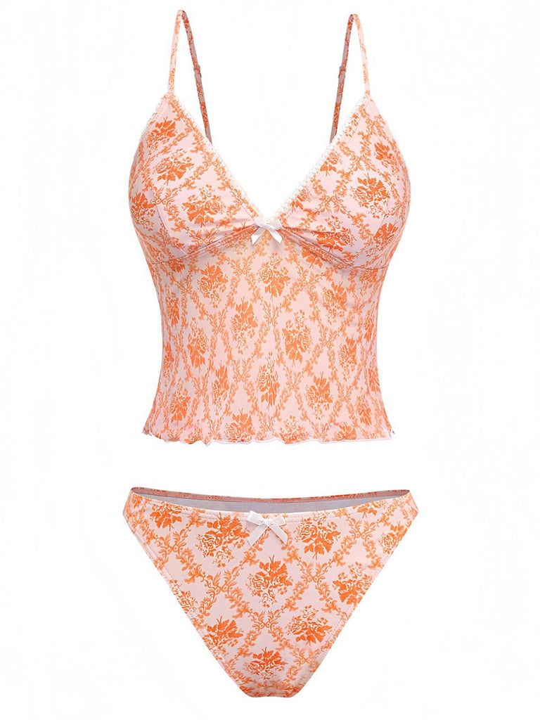 Retro orange deep V-neck tankini featuring ditsy floral pattern in 70s style, ideal for summer getaways and vintage-themed pool parties