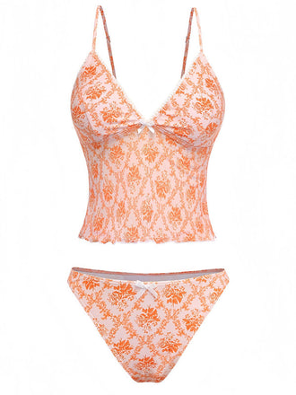 Retro orange deep V-neck tankini featuring ditsy floral pattern in 70s style, ideal for summer getaways and vintage-themed pool parties