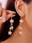 Boucles d'oreilles alliage représentant une étoile mer un coquillage et une perle