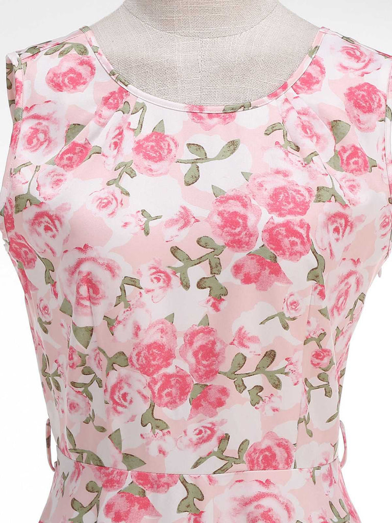 Close-up of the dress bodice showing the intricate pink rose and green leaf botanical design.