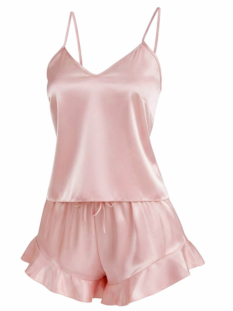 Side view of the pink satin sleepwear set showing the lightweight drape and comfortable fit of the cami and shorts.