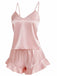 Side view of the pink satin sleepwear set showing the lightweight drape and comfortable fit of the cami and shorts.