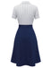 Rear view of the pinstripe blouse and navy blue skirt outfit.