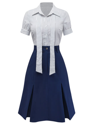 Front view of the coordinated pinstripe blouse and navy blue A-line skirt set.