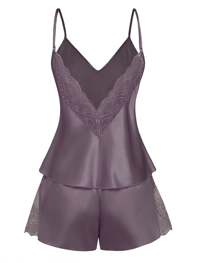Purple satin camisole and shorts set with lace details on a white background
