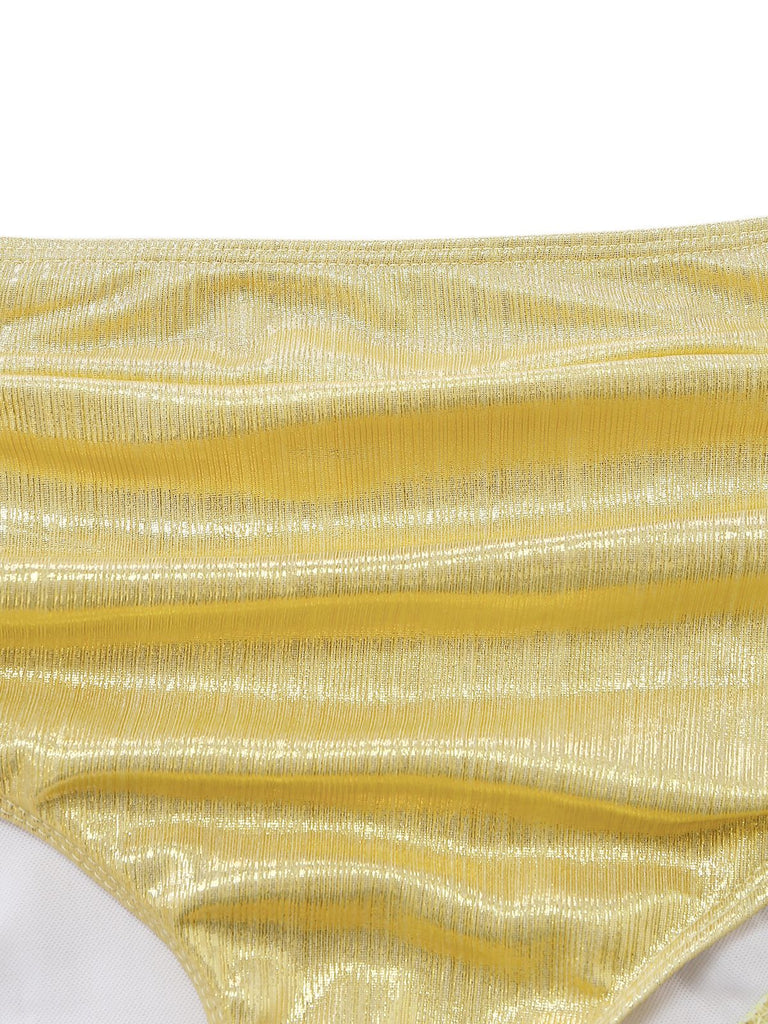 A macro view of the gold shimmering fabric used for the vintage-style metallic bikini.