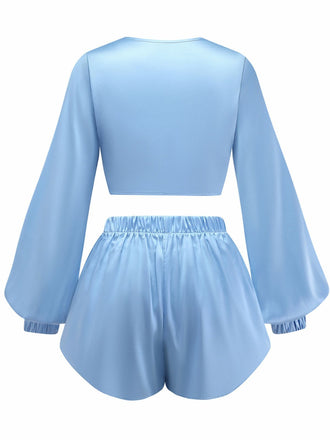 Back view of the light blue satin lounge set, highlighting the loose fit and comfortable elastic waistband on the shorts.