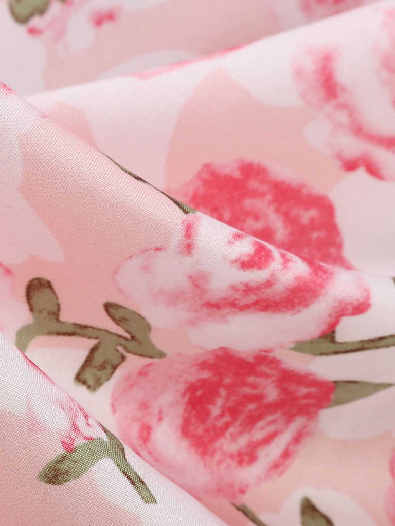 A swirled close-up of the dress fabric highlighting its soft, lightweight texture and vibrant pink hues.