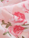 A swirled close-up of the dress fabric highlighting its soft, lightweight texture and vibrant pink hues.