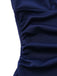 Detailed view of the horizontal side ruching and pleated fabric on the waist of the navy blue dress.