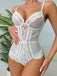 Angled front view of the model wearing the white bodysuit, focusing on the scalloped lace trim and mesh inserts.