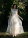 Robe en maille jaune florale à lacets et baleines des années 1930