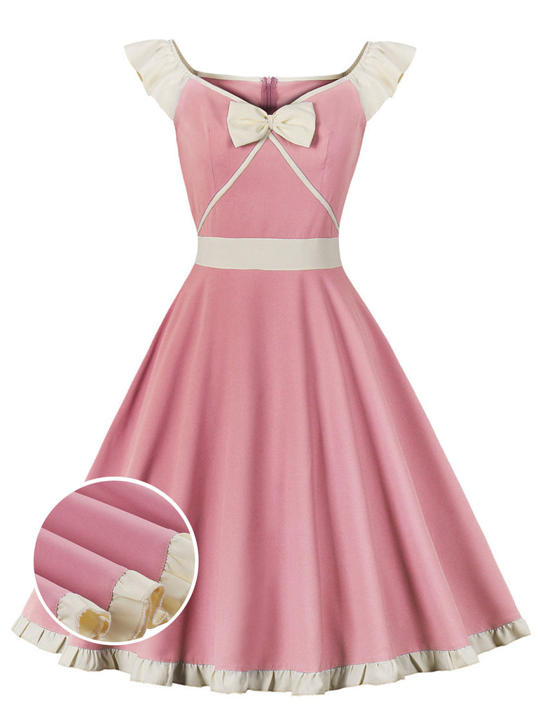 Robe trapèze rose années 50 avec col en cœur et nœud