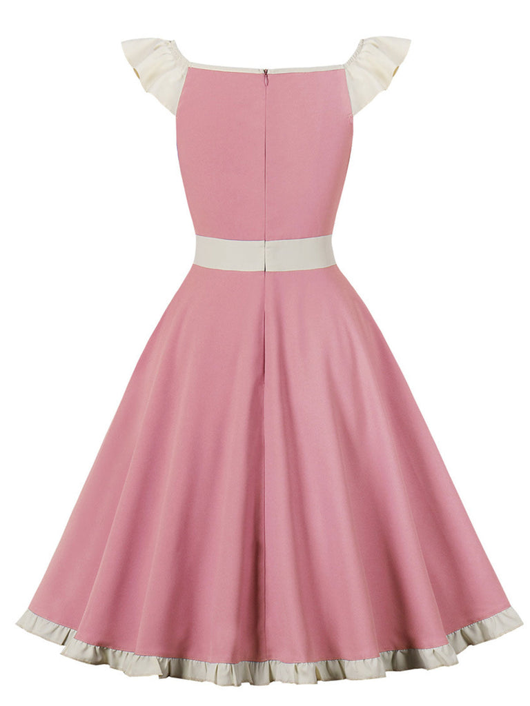 Robe trapèze rose années 50 avec col en cœur et nœud