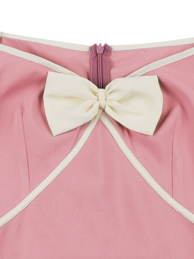 Robe trapèze rose années 50 avec col en cœur et nœud