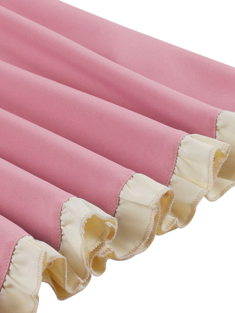 Robe trapèze rose années 50 avec col en cœur et nœud