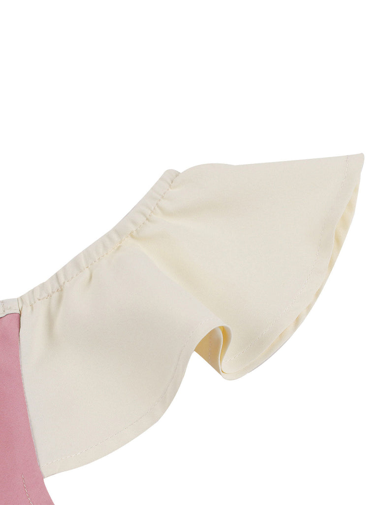 Robe trapèze rose années 50 avec col en cœur et nœud