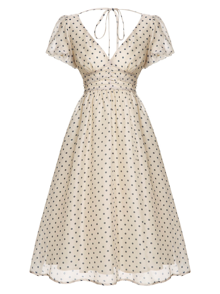 Robe à col en V beige à pois des années 1950