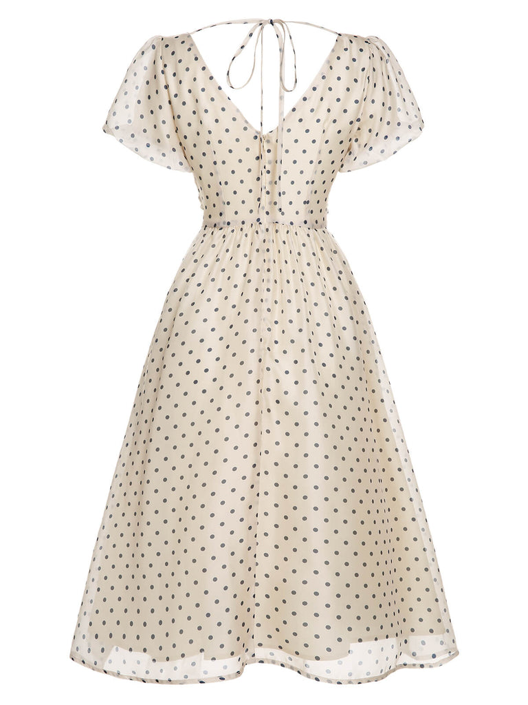 Robe à col en V beige à pois des années 1950
