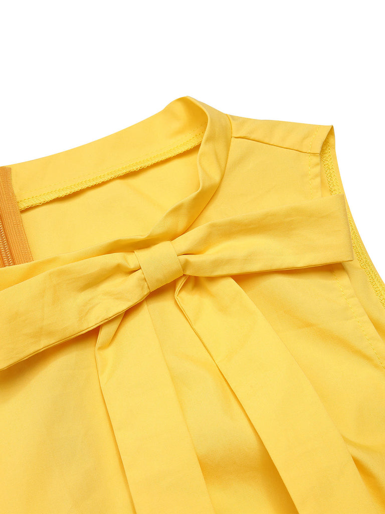 Robe patchwork jaune avec noeud papillon marguerite des années 1950