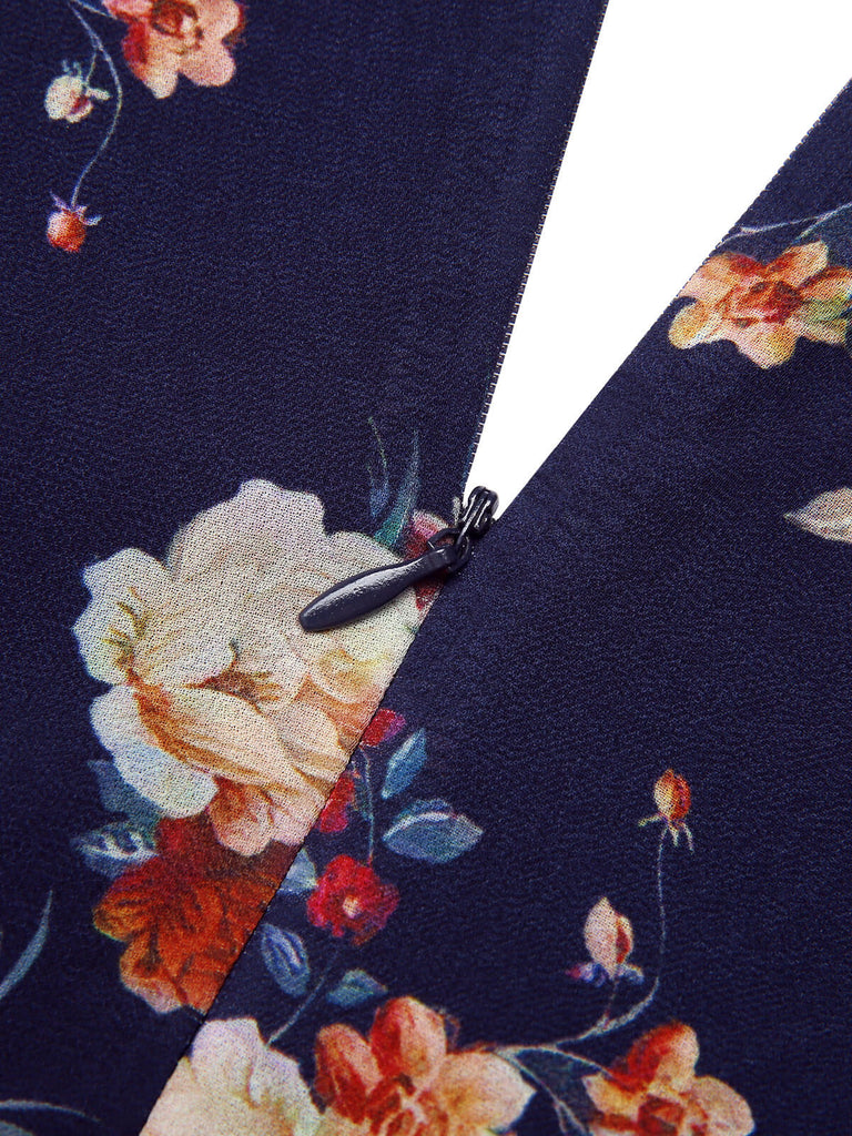 Robe bleu marine à fleurs et manches bouffantes