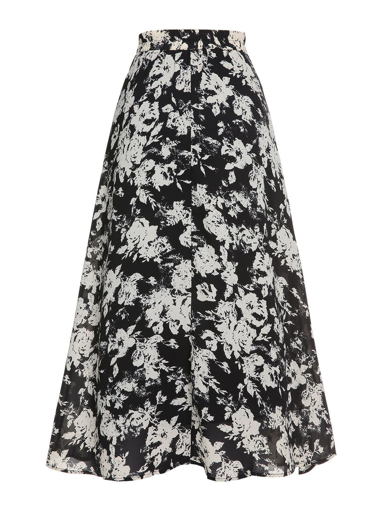Jupe trapèze florale noire et blanche des années 1960