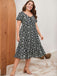 Robe noire et blanche grande taille à petites fleurs des années 1950