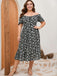 Robe noire et blanche grande taille à petites fleurs des années 1950