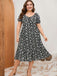Robe noire et blanche grande taille à petites fleurs des années 1950
