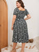 Robe noire et blanche grande taille à petites fleurs des années 1950