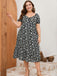 Robe noire et blanche grande taille à petites fleurs des années 1950