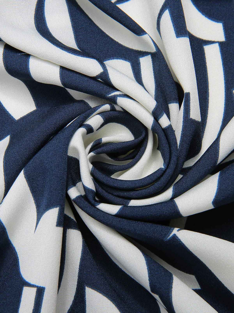 Robe bleu marine à col en V imprimé géométrique des années 1930