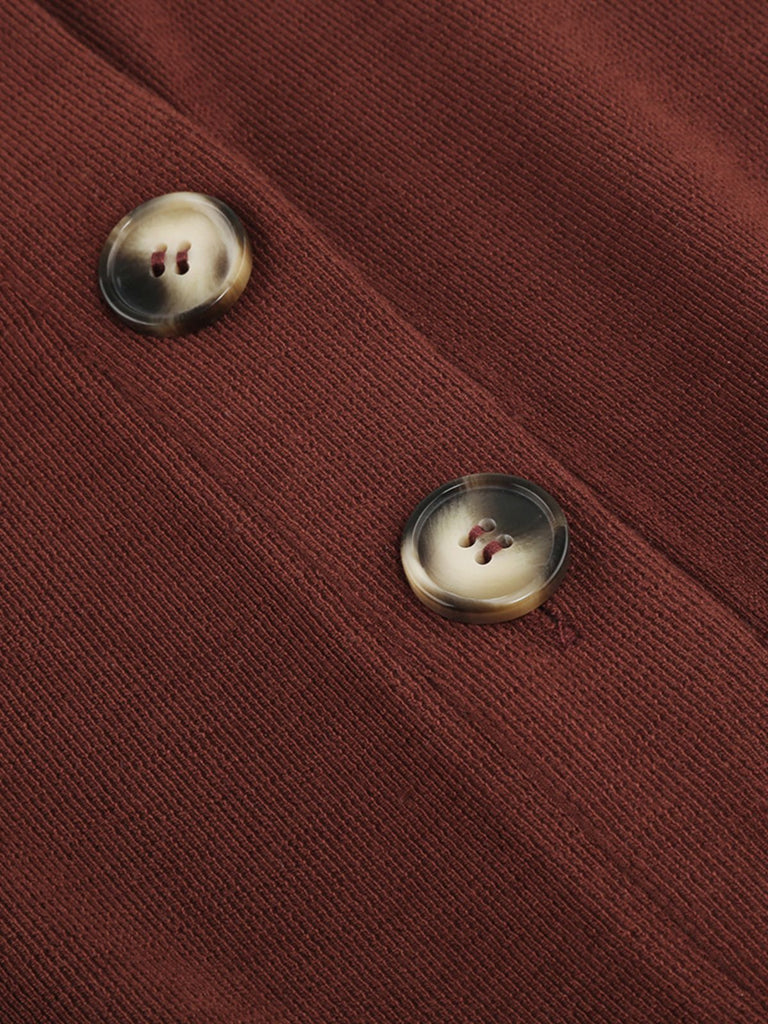 Combinaison en tricot à revers à boutons solides des années 1930