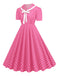 Robe trapèze à revers et nœud papillon à pois des années 1950